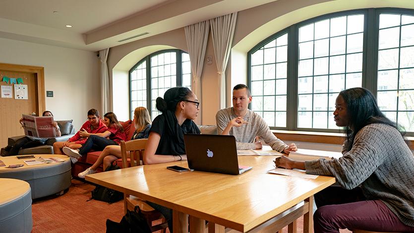 marist students sitting in the common area of a residence hall