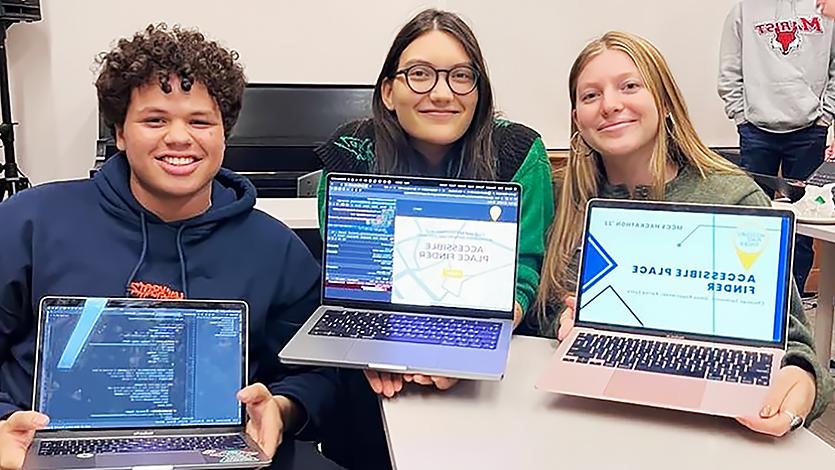 Image of Karina and other students at Hackathon 